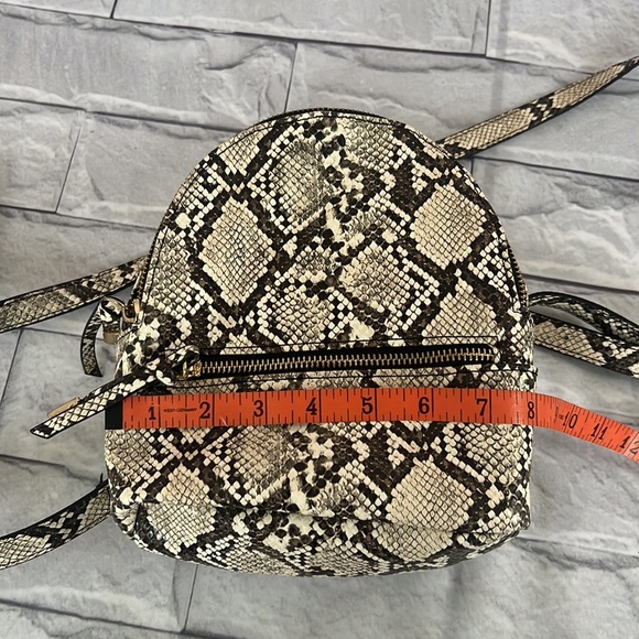 Steve Madden serpentine print small backpack - Picture 8 of 9
